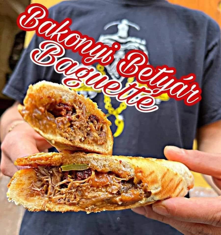 A Bakonyi Betyár baguette held toward the camera