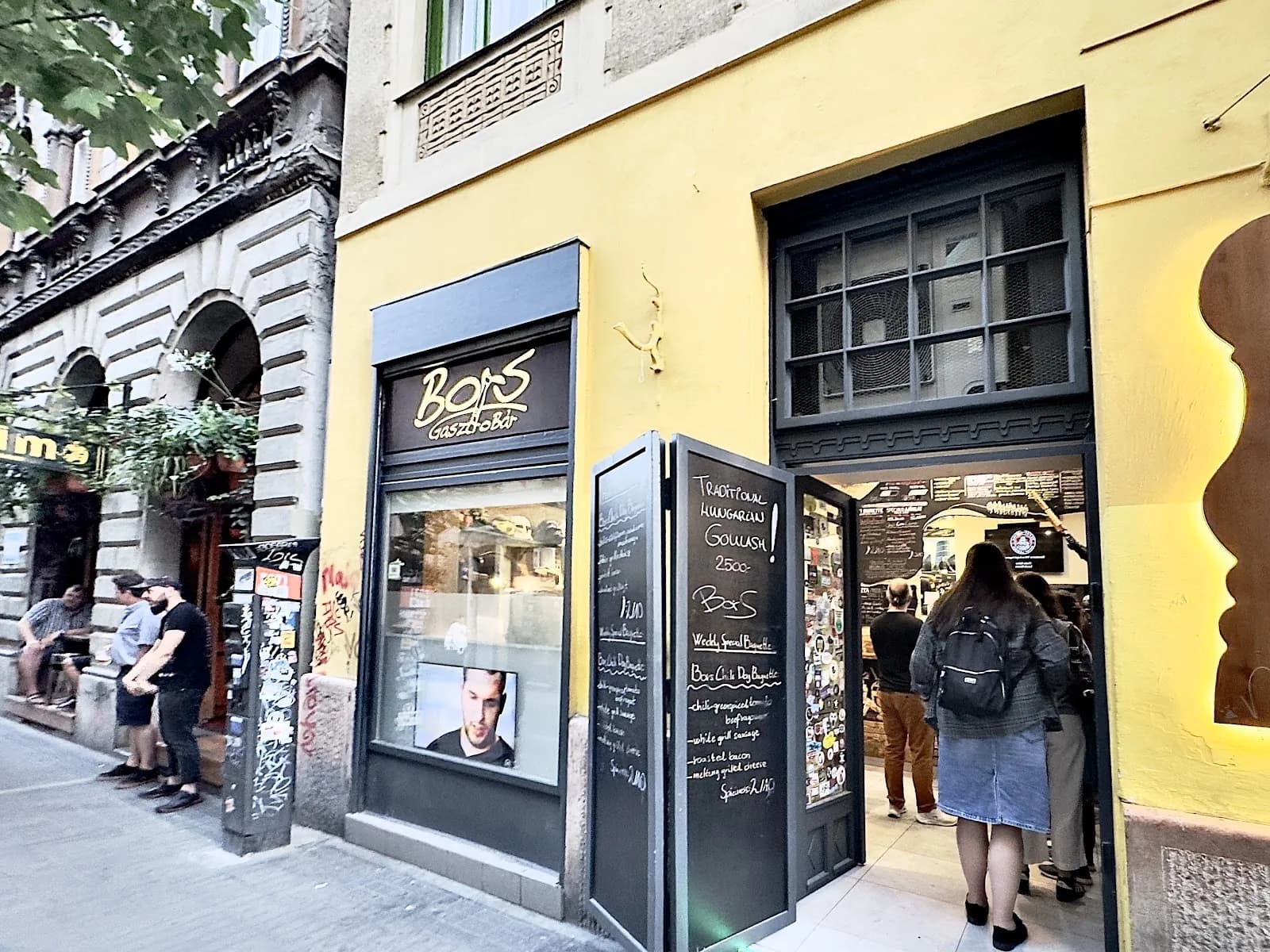The open yellow frontage of Bors Gastro Bar on Kazinczy Street