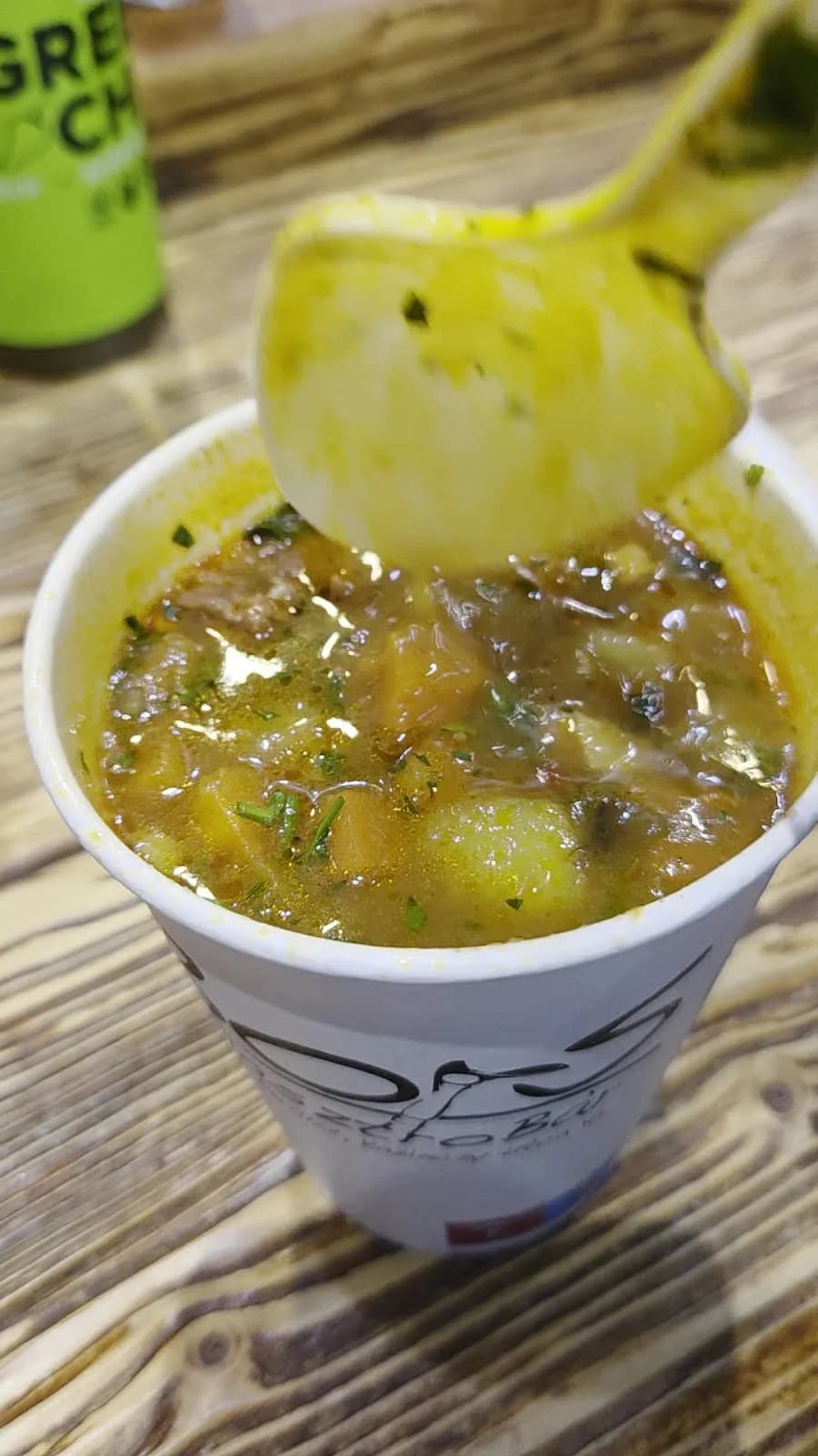 A cup of Bors daily soup with a ladle
