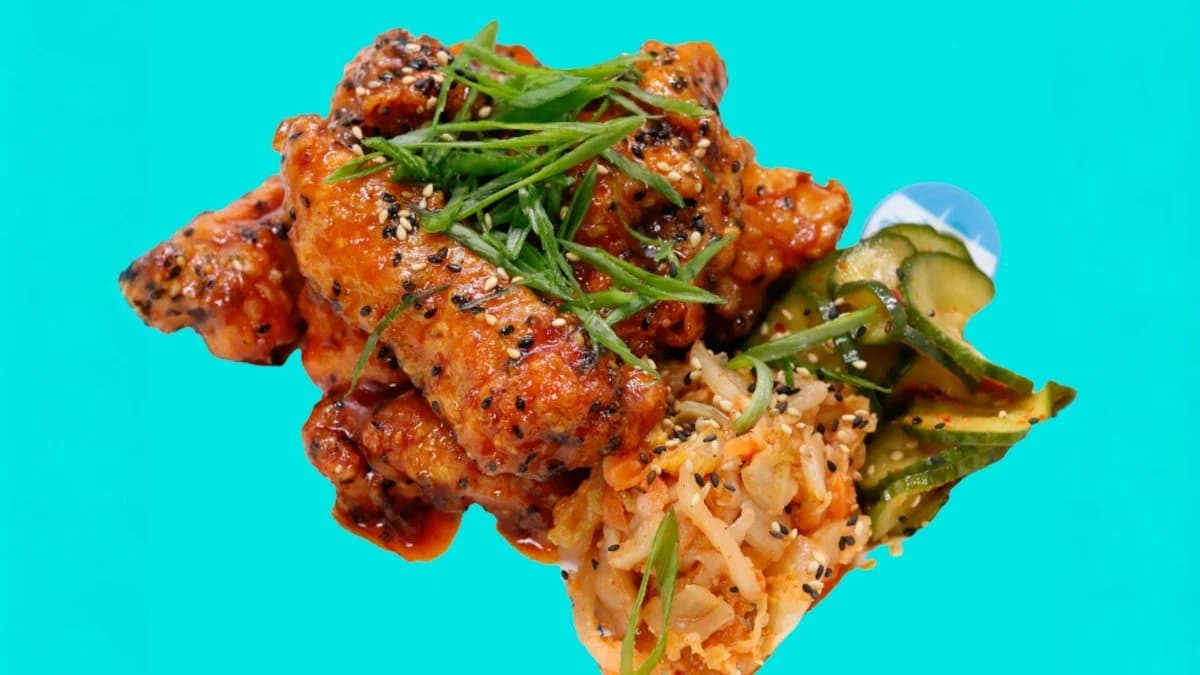 Glazed fried chicken strips with kimchi and pickled cucumber