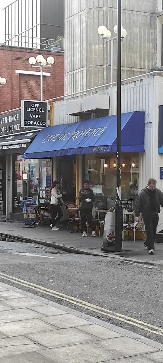 Café de Provence and its outdoor tables seen from across Drury Lane