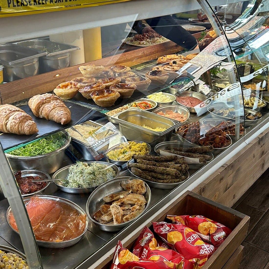 The fresh food counter with salads, pastries and prepared dishes