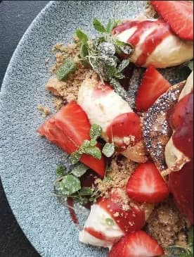 Strawberry-topped sweet brunch plate from Cafe Strange Brew's Instagram