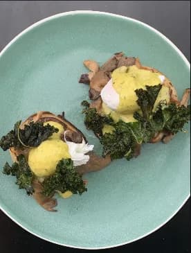 Eggs Benedict-style brunch with mushrooms from Cafe Strange Brew's Instagram