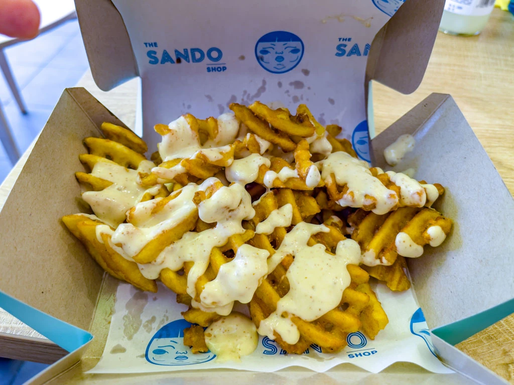 Seasoned waffle fries in original Sando Shop packaging